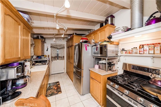 kitchen featuring light tile patterned flooring, sink, wooden ceiling, appliances with stainless steel finishes, and beam ceiling