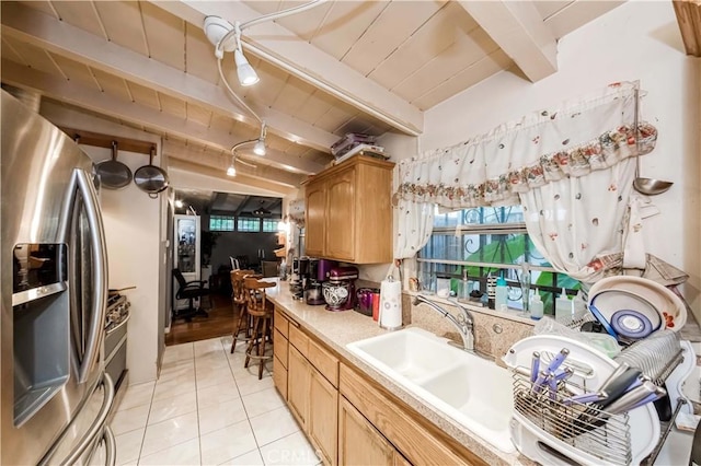 kitchen with wood ceiling, stainless steel fridge with ice dispenser, light tile patterned floors, and beamed ceiling