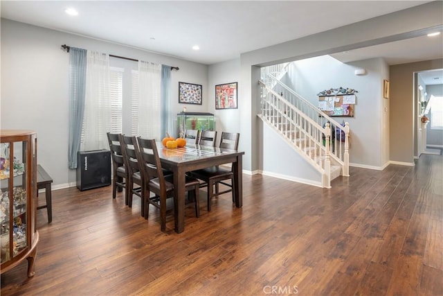 dining space featuring dark hardwood / wood-style floors