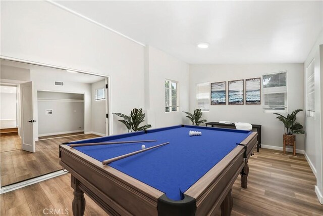 game room with lofted ceiling, hardwood / wood-style flooring, and billiards