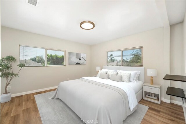 bedroom with light wood-type flooring