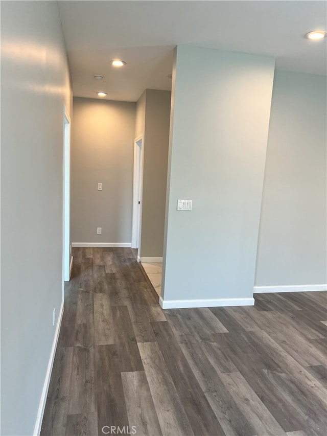 corridor featuring dark hardwood / wood-style flooring