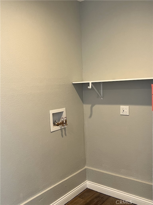 laundry area featuring hookup for a washing machine and hardwood / wood-style floors