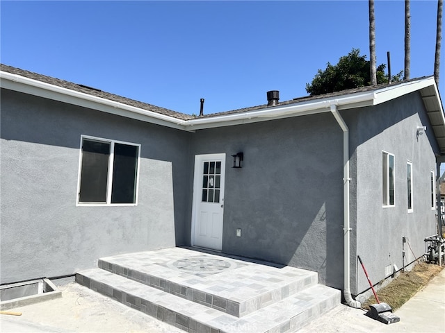 property entrance with a patio