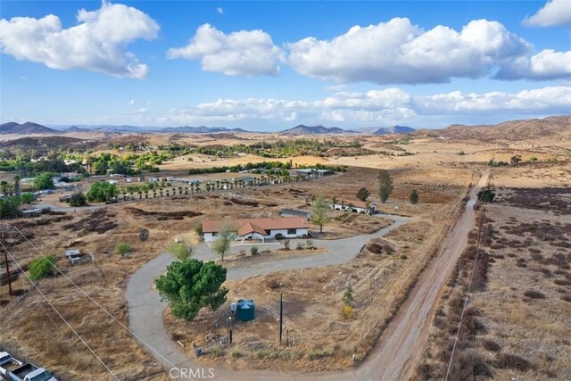 birds eye view of property with a mountain view and a rural view