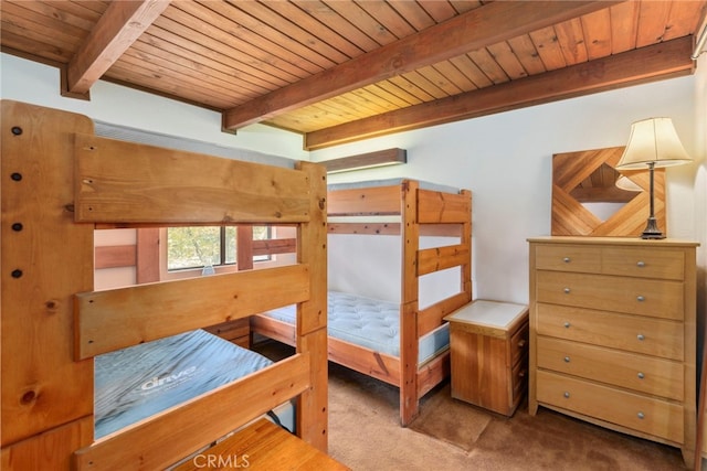 carpeted bedroom with beam ceiling and wooden ceiling