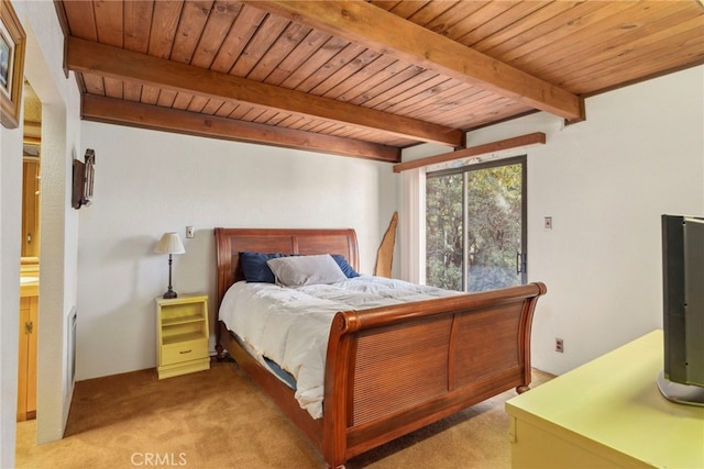 carpeted bedroom featuring beamed ceiling and wooden ceiling