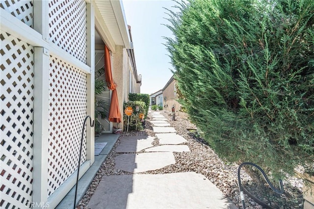 view of property exterior with a patio area