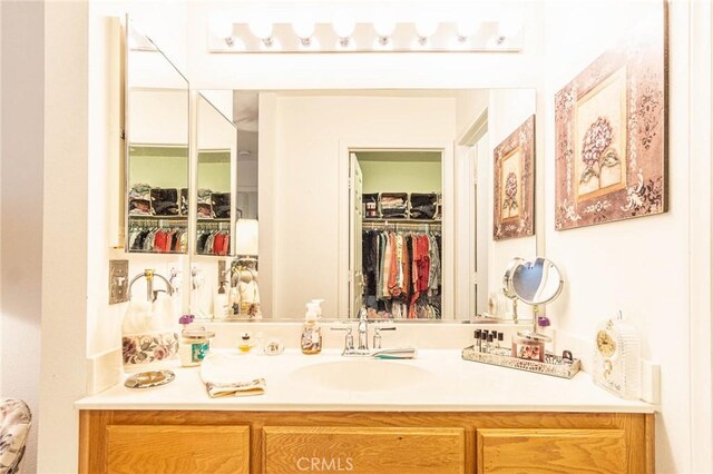 19046 Stoddard Way, Apple Valley, CA 92308 - bathroom with vanity and a walk in closet