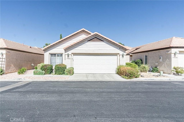 single story home featuring a garage