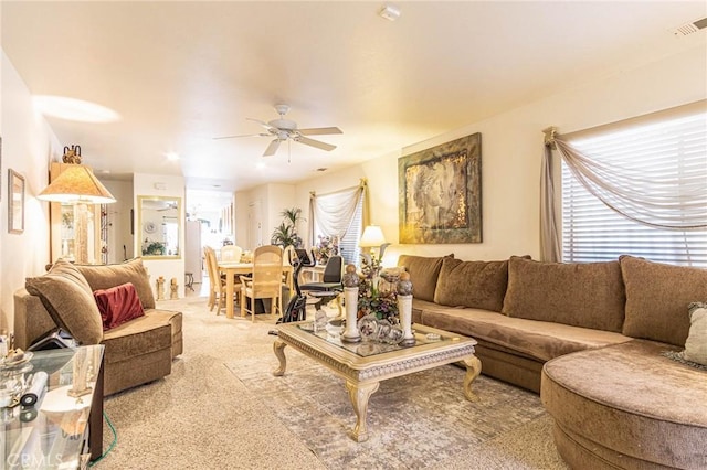 living room with ceiling fan and light carpet