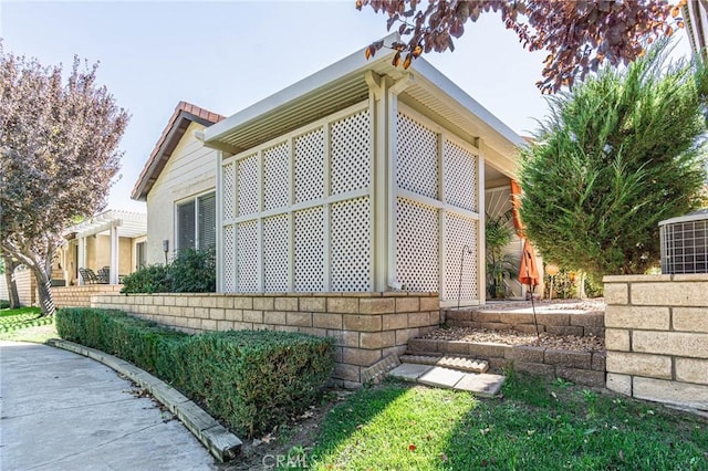 view of home's exterior featuring a pergola