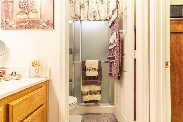 19046 Stoddard Way, Apple Valley, CA 92308 - bathroom featuring vanity, a shower stall, and tile patterned floors