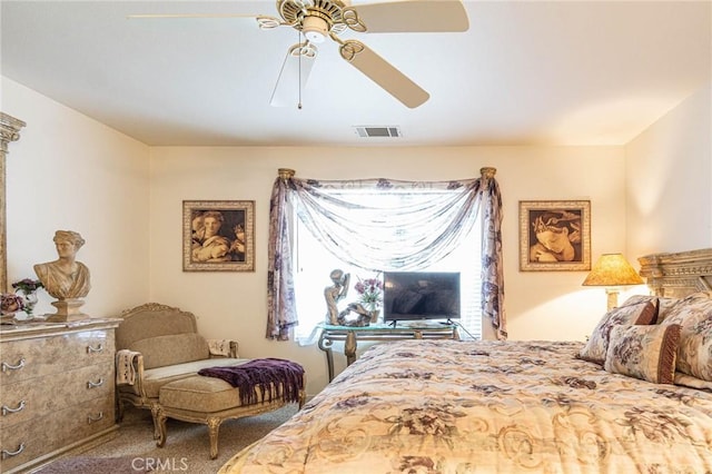 bedroom with carpet flooring, ceiling fan, and multiple windows