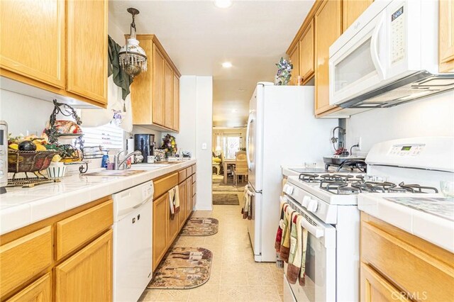 19046 Stoddard Way, Apple Valley, CA 92308 - kitchen featuring white appliances, recessed lighting, tile counters, and light tile patterned flooring