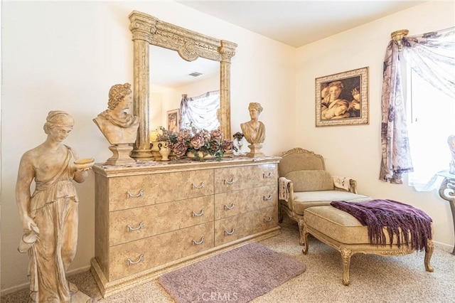 sitting room featuring carpet flooring