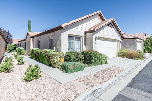 single story home with a garage