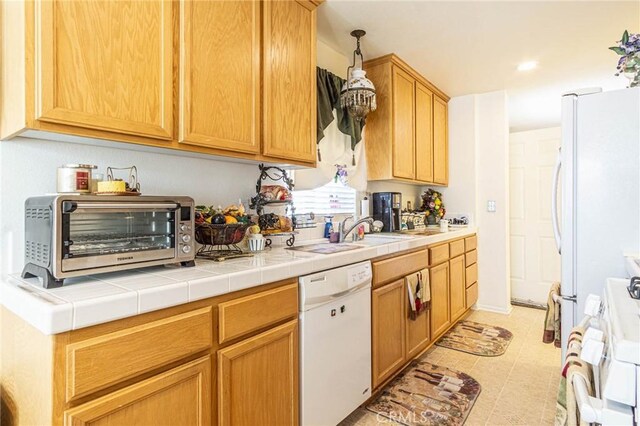 19046 Stoddard Way, Apple Valley, CA 92308 - kitchen with white dishwasher, range, and tile countertops