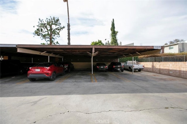 view of vehicle parking with a carport