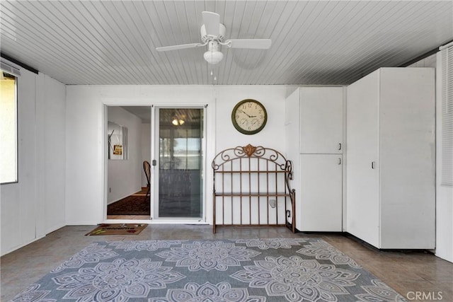 entrance to property with ceiling fan