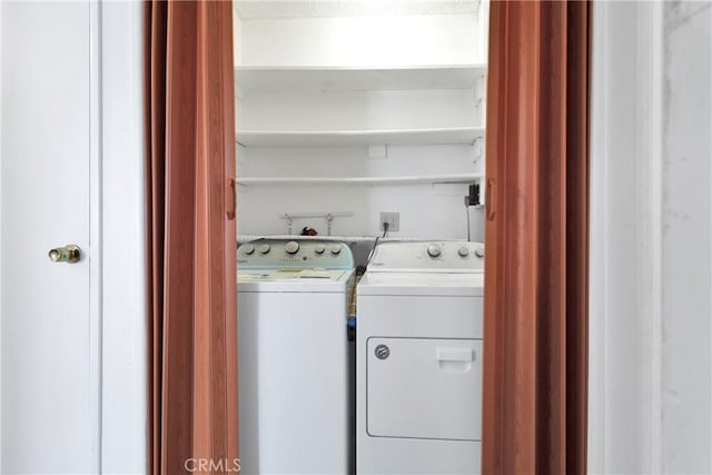 laundry area featuring washer and clothes dryer