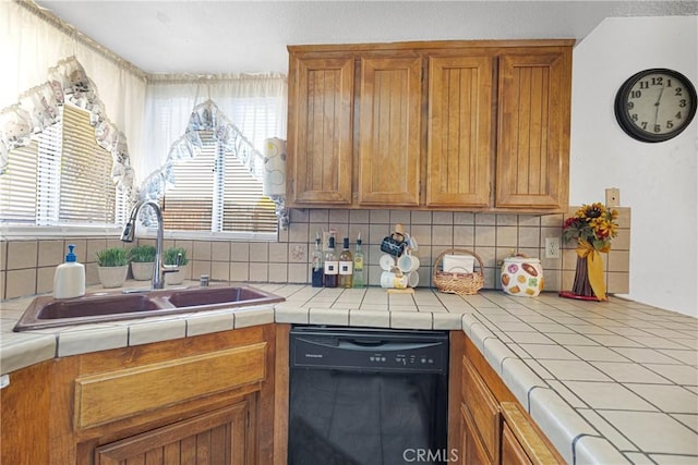 kitchen featuring dishwasher, tasteful backsplash, and tile counters