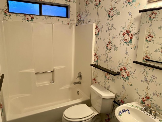 bathroom with shower / bath combination and toilet