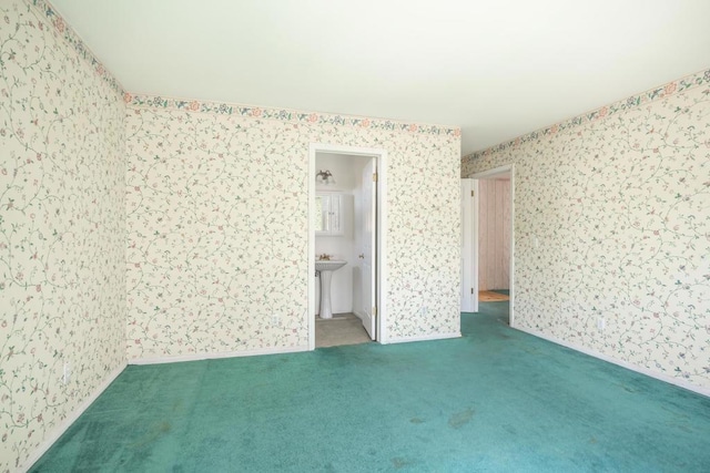 empty room with light colored carpet and sink