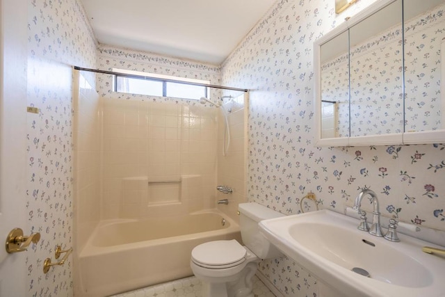 full bathroom featuring toilet, bathtub / shower combination, and sink