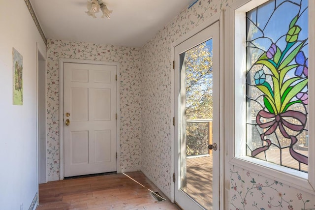 entryway with hardwood / wood-style flooring