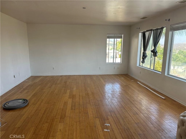 spare room featuring light wood-type flooring