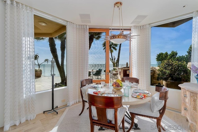 dining space with a water view