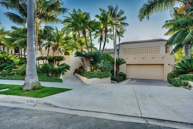 mediterranean / spanish-style house featuring a garage