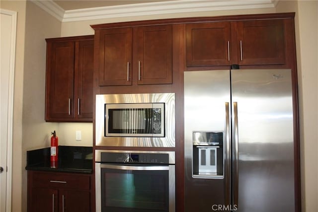 kitchen featuring stainless steel appliances and crown molding