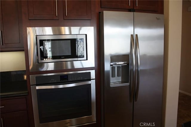 kitchen with dark brown cabinets and stainless steel appliances