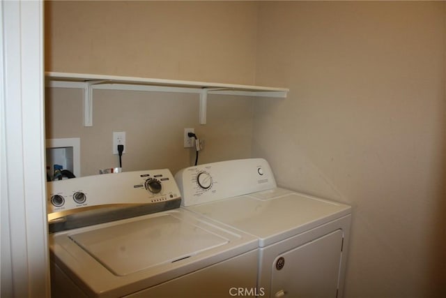 laundry room featuring separate washer and dryer