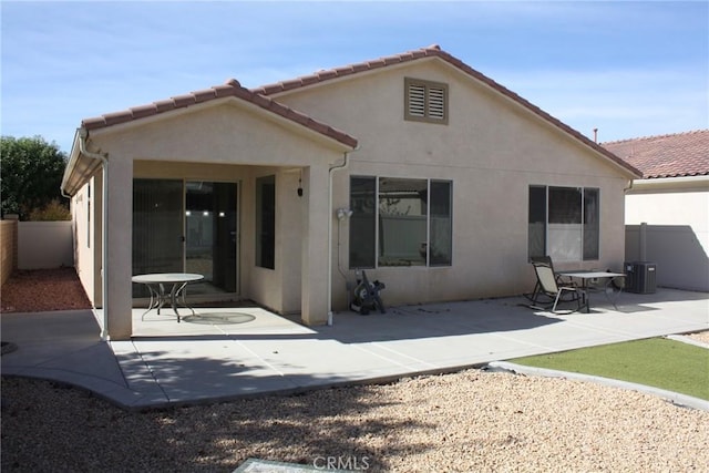 back of house with a patio area