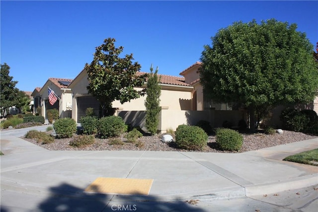 view of side of home with a garage