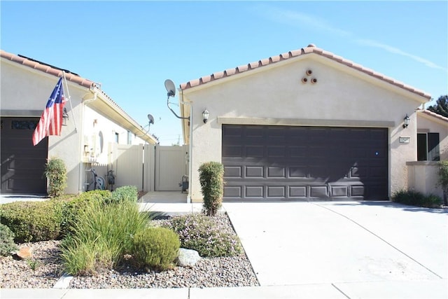 mediterranean / spanish-style house featuring a garage