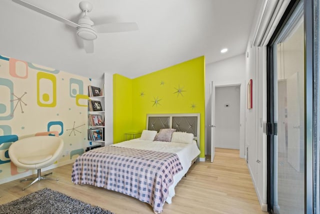 bedroom featuring ceiling fan and light hardwood / wood-style flooring