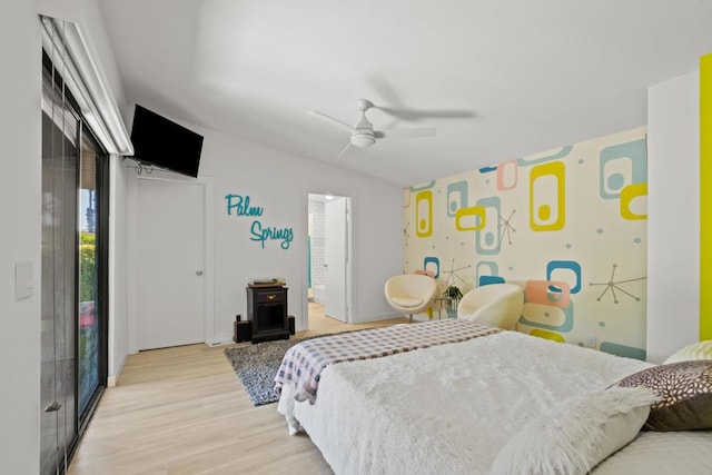 bedroom featuring ceiling fan, access to outside, and light hardwood / wood-style flooring