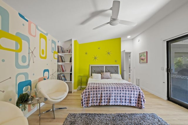 bedroom featuring access to outside, ceiling fan, and wood-type flooring