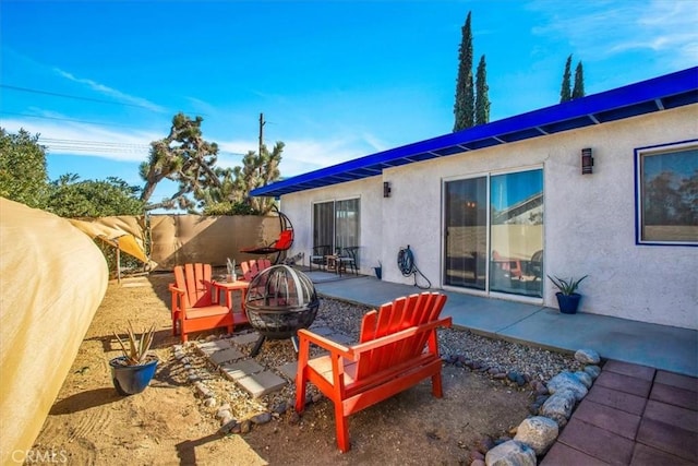 view of patio / terrace with a fire pit