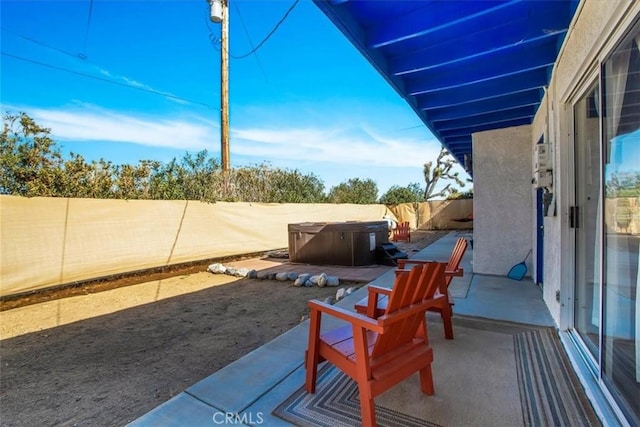 view of patio with a hot tub