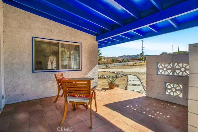 view of patio / terrace with a mountain view