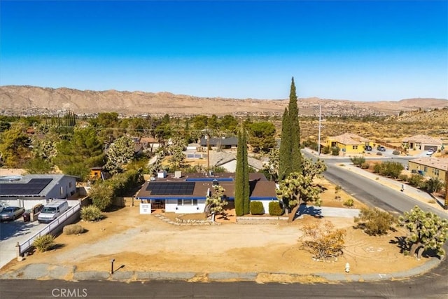 birds eye view of property featuring a mountain view