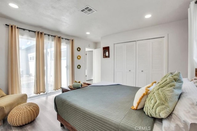 bedroom with a closet and wood-type flooring