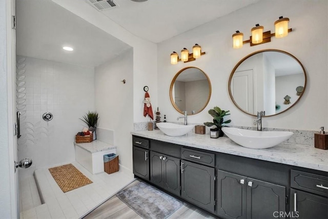 bathroom with vanity and hardwood / wood-style flooring