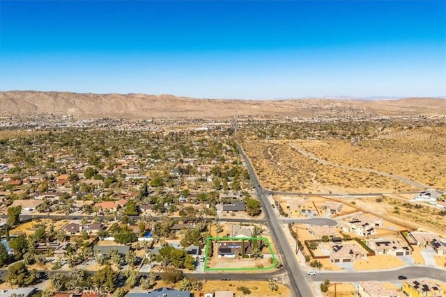 drone / aerial view featuring a mountain view