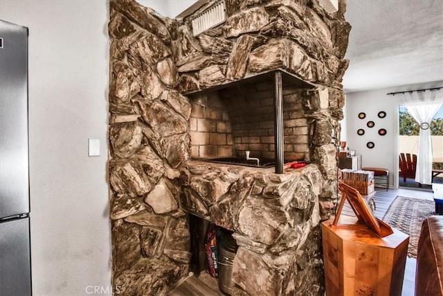 miscellaneous room featuring hardwood / wood-style flooring and a textured ceiling